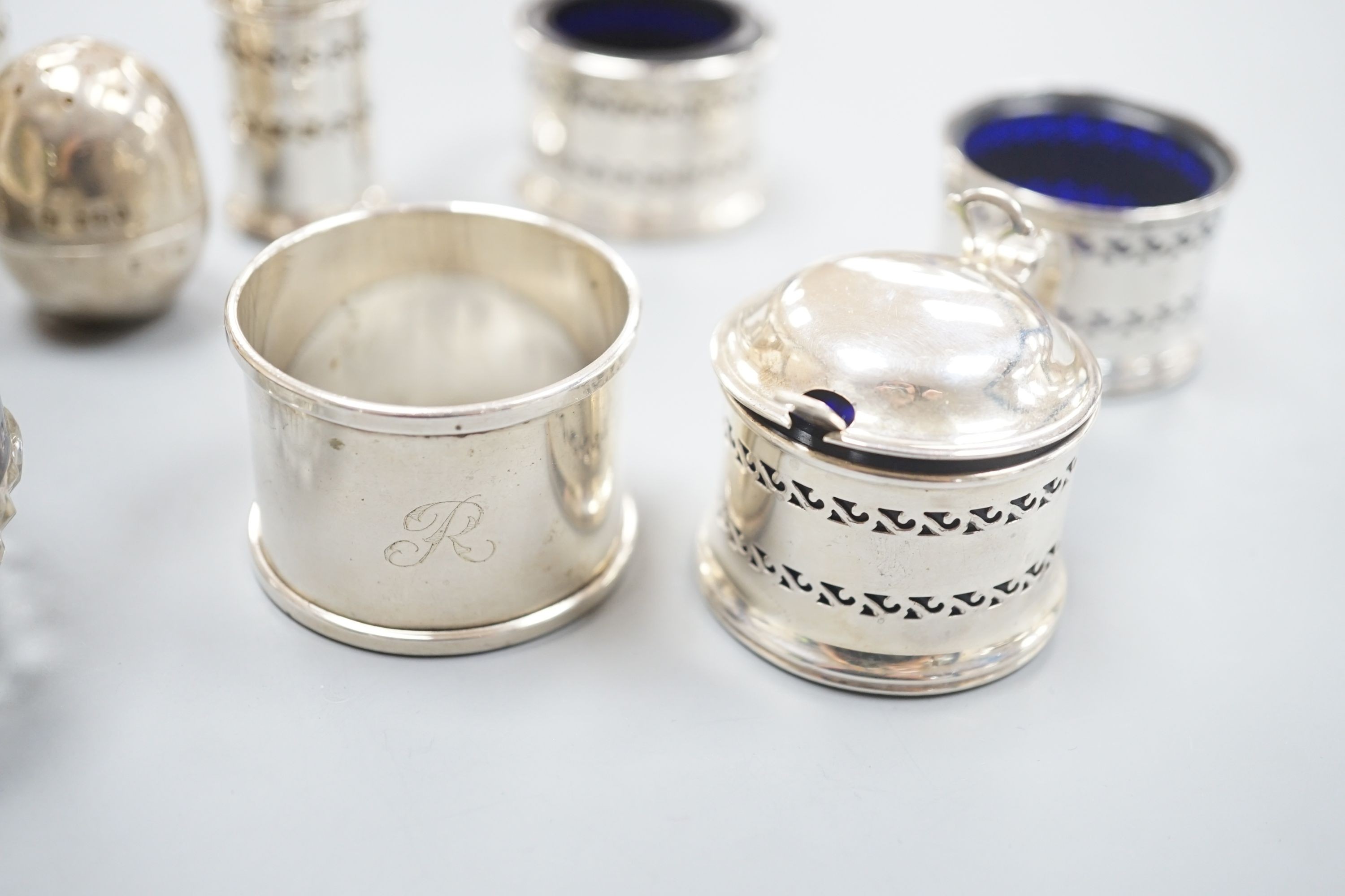 Five assorted silver condiments, napkin ring and silver shell dish with glass liner, etc